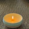 Beeswax Candle Hand-poured fragranced beeswax candle in handmade pottery.